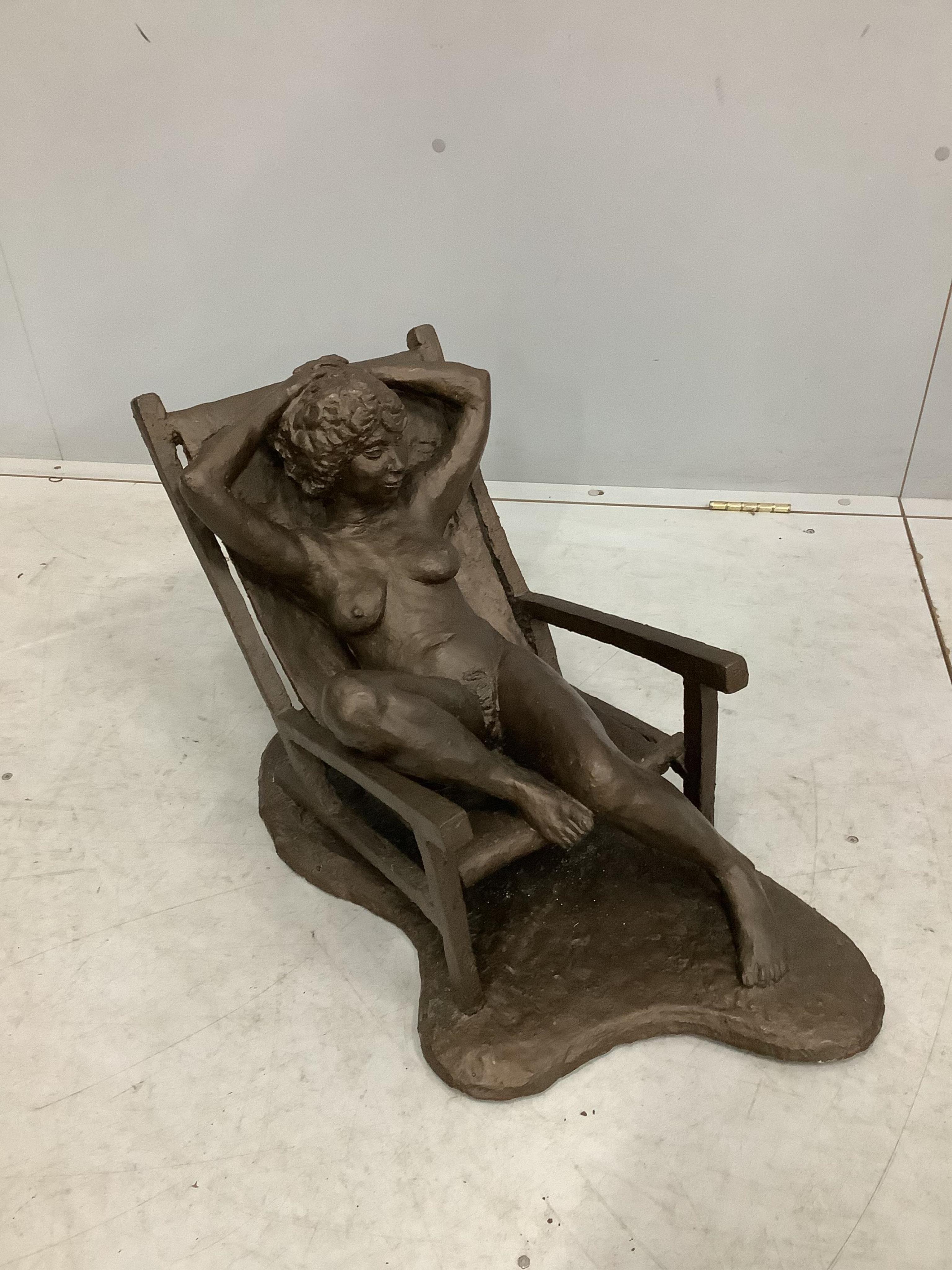 Norman Barrow (Modern British) a bronzed composition sculpture, female nude reclining in a chair, height 39cm. Condition - fair